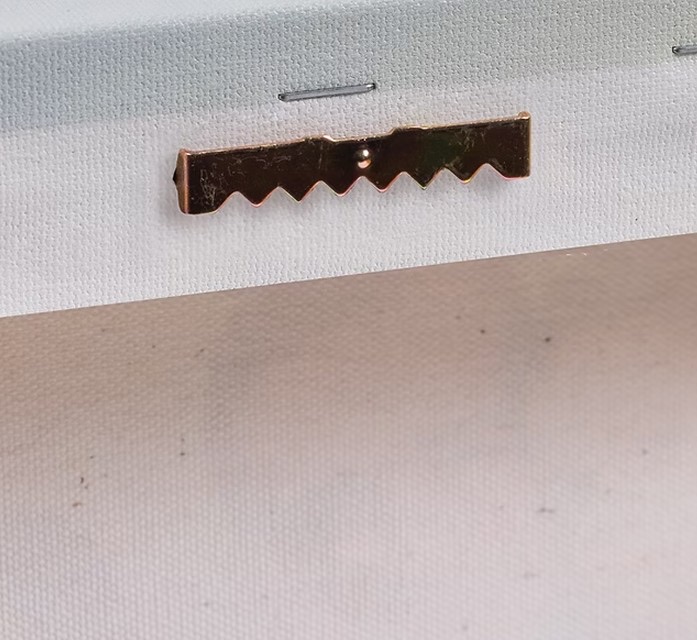 Close-up of the metal hanging hardware on a canvas print