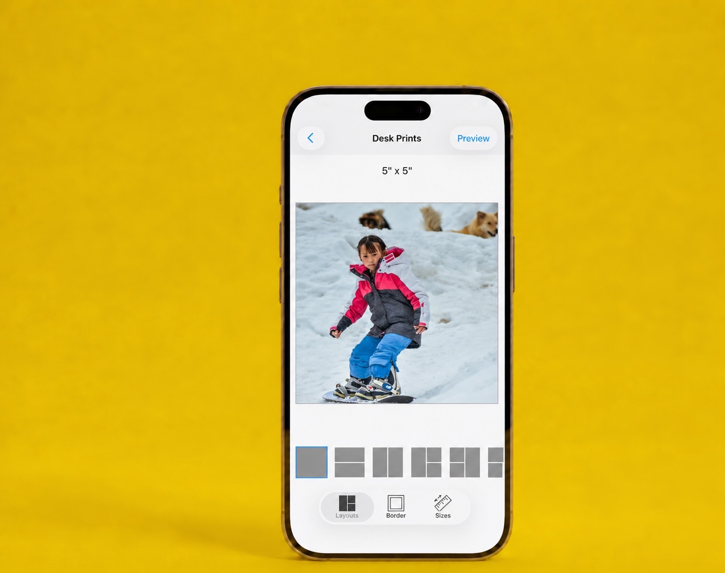 The SimplePrints app showing a 5×5 desk print of a child snowboarding