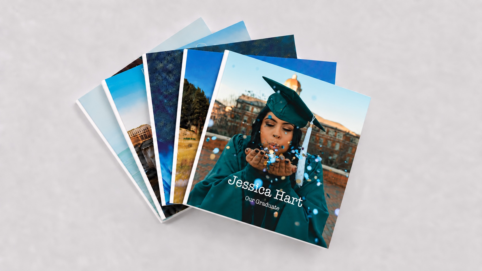 A fan of graduation photo books, the top one titled Jessica Hart