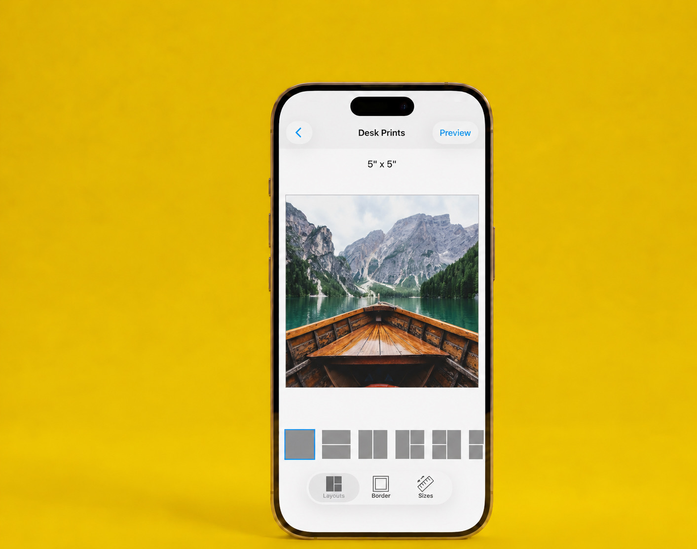 The SimplePrints app showing a 5×5 desk print of a boat on a mountain lake