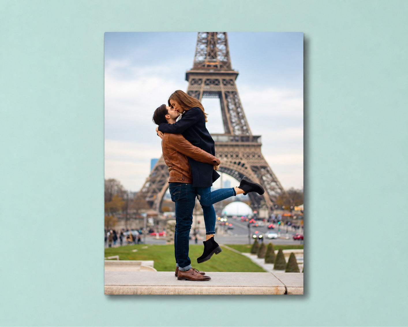 A travel metal print of a couple kissing in front of the Eiffel Tower