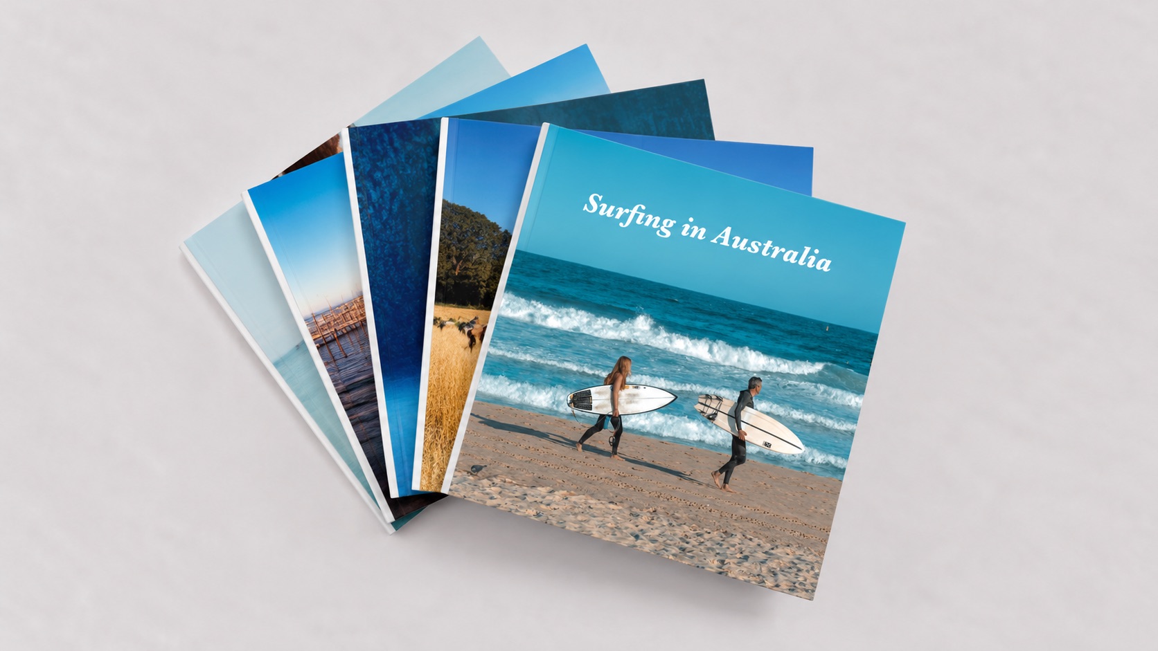 A fan of travel photo books, the top one titled Surfing in Australia